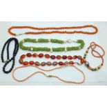 An assortment of vintage necklaces, including agate