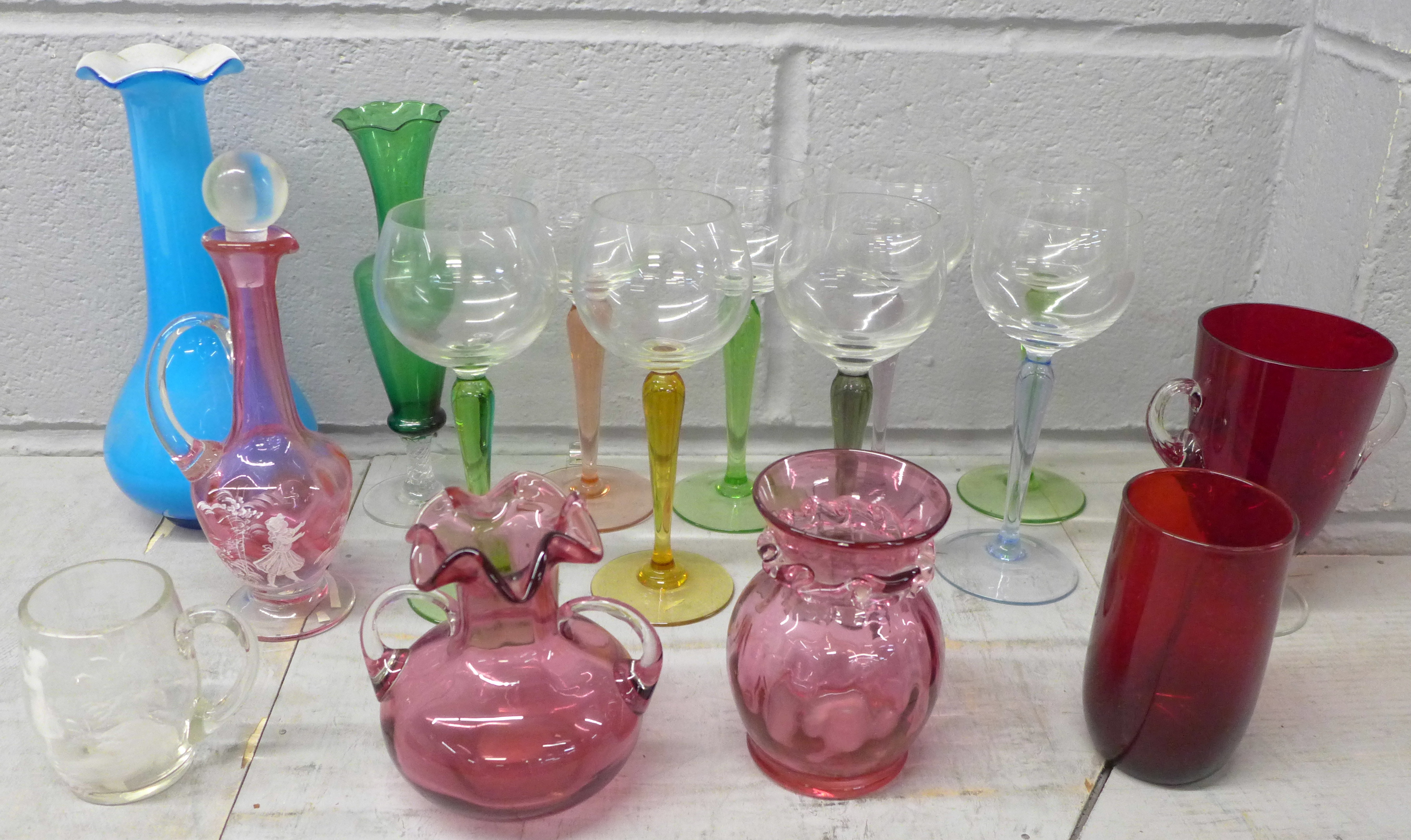 A set of eight hock glasses with coloured stems, cranberry glass, other coloured glass and a Mary