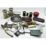 Assorted items including binoculars, lighters, novelty bottle stops, corkscrews, etc.