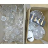 A box of cut glass drinking glasses, three glass bowls, biscuit barrel, jugs, cheese knife set,