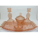 A peach glass dressing table set, tray chipped