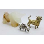 A small, solid 925 silver gilt model bull, 59g, a carved bull and a water buffalo pendant or charm