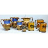 Five copper lustre jugs and three coaching scenes mugs