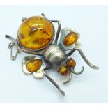 A large white metal and amber insect brooch, 47mm x 34mm