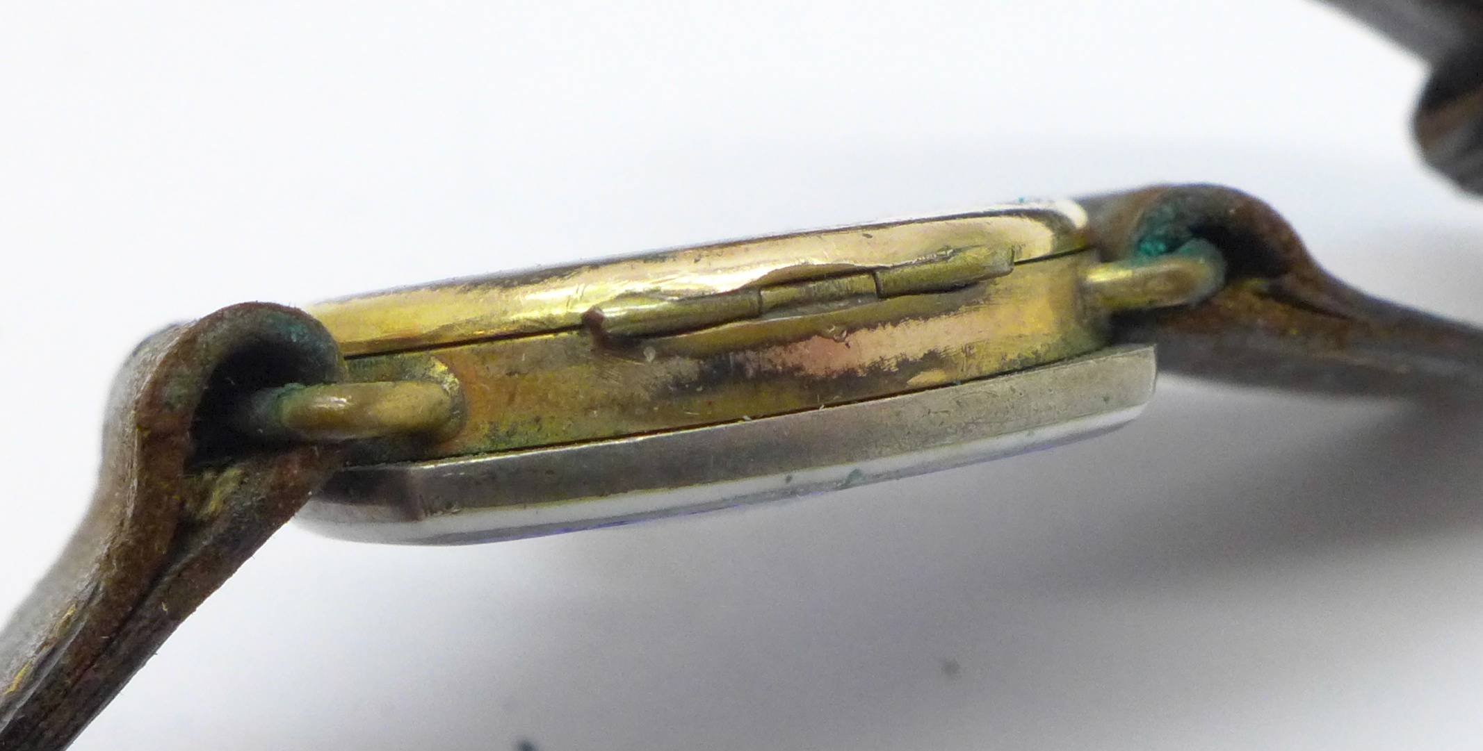 An enamelled wristwatch, glass cracked, the gold plated case back worn, 25mm - Image 4 of 5