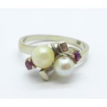 A 14ct white gold, crossover pearl and red stone ring, 4.3g, P