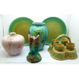 A Majolica triple fish vase, a/f, Majolica egg cups and stand, two Royal Doulton plates with green