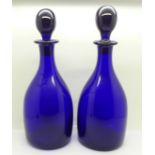 A pair of 19th Century Bristol blue glass decanters, 27.5cm