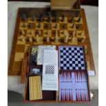 A cased games compendium, a box of chess pieces and a chessboard **PLEASE NOTE THIS LOT IS NOT