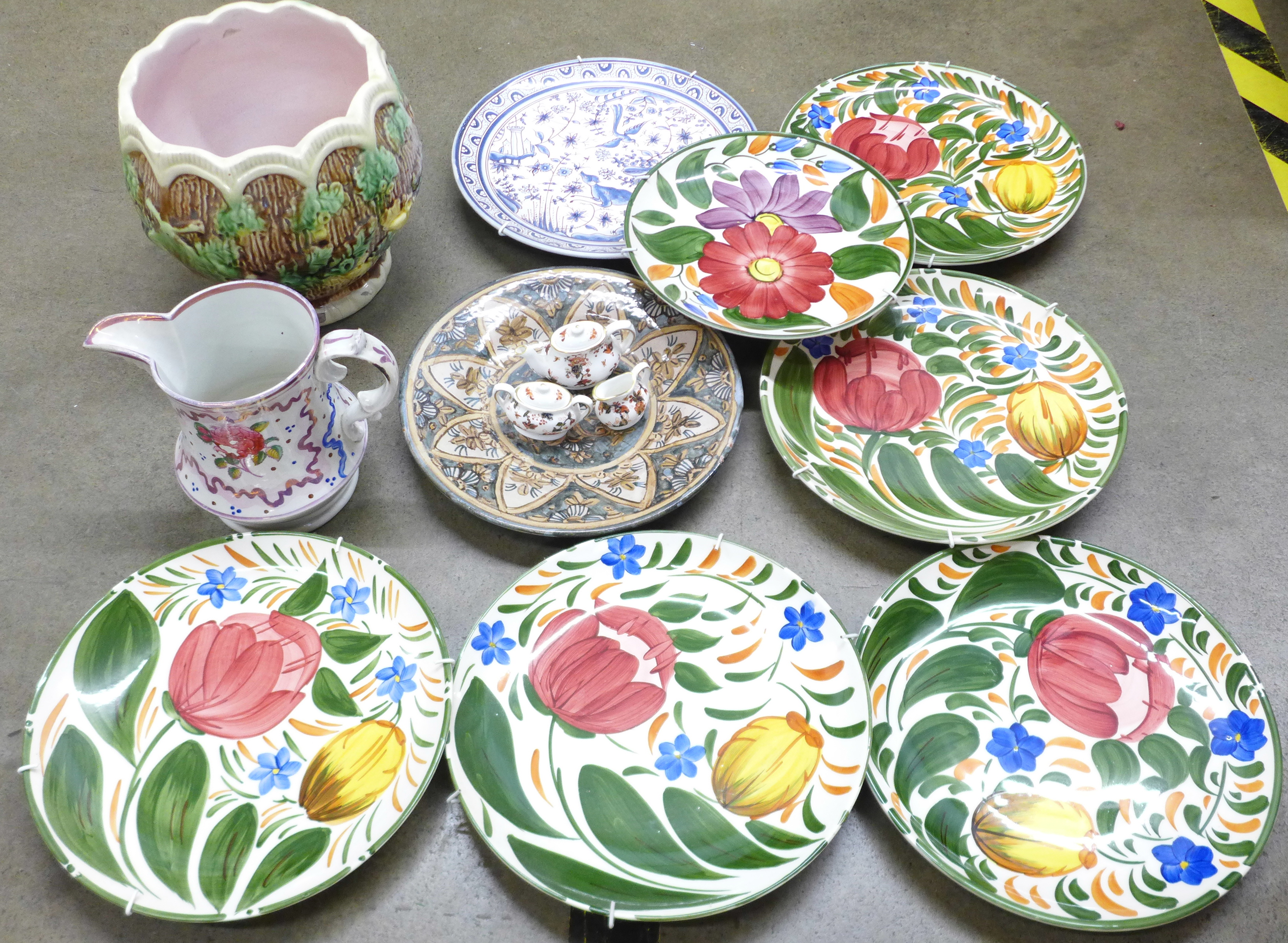 Six Wade hand painted plates, a 19th Century Sunderland lustre jug, a majolica jardiniere, two