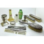 A pair of dwarf silver candlesticks, silver backed brushes, comb, silver handled button hook and