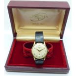 A 9ct gold Longines wristwatch with subsidiary second dial, case back with inscription dated 1970,