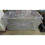 A galvanised wirework storage cage, 70cms h, 122cms w, 46cms d