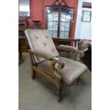 A Victorian mahogany and upholstered reclining armchair