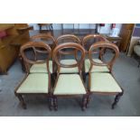 A set of six Victorian mahogany balloon back dining chairs