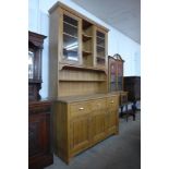 A pine dresser, 253cms h, 147cms w, 64cms d