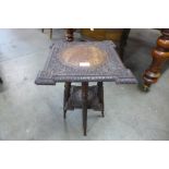 An early 20th Century Burmese carved hardwood occasional table, 51cms h