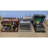 Two vintage Imperial typewriters and a Singer sewing machine