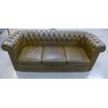 A Chesterfield olive green leather settee, 75cms h, 206cms w, 82cms d