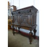 A 19th Century French carved oak livery cupboard on stand, 143cms h, 136cms w, 58cms d
