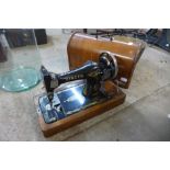 A walnut cased Singer sewing machine