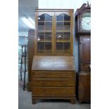 An early 20th Century oak bureau bookcase, 210cms h, 92cms w, 44cms d