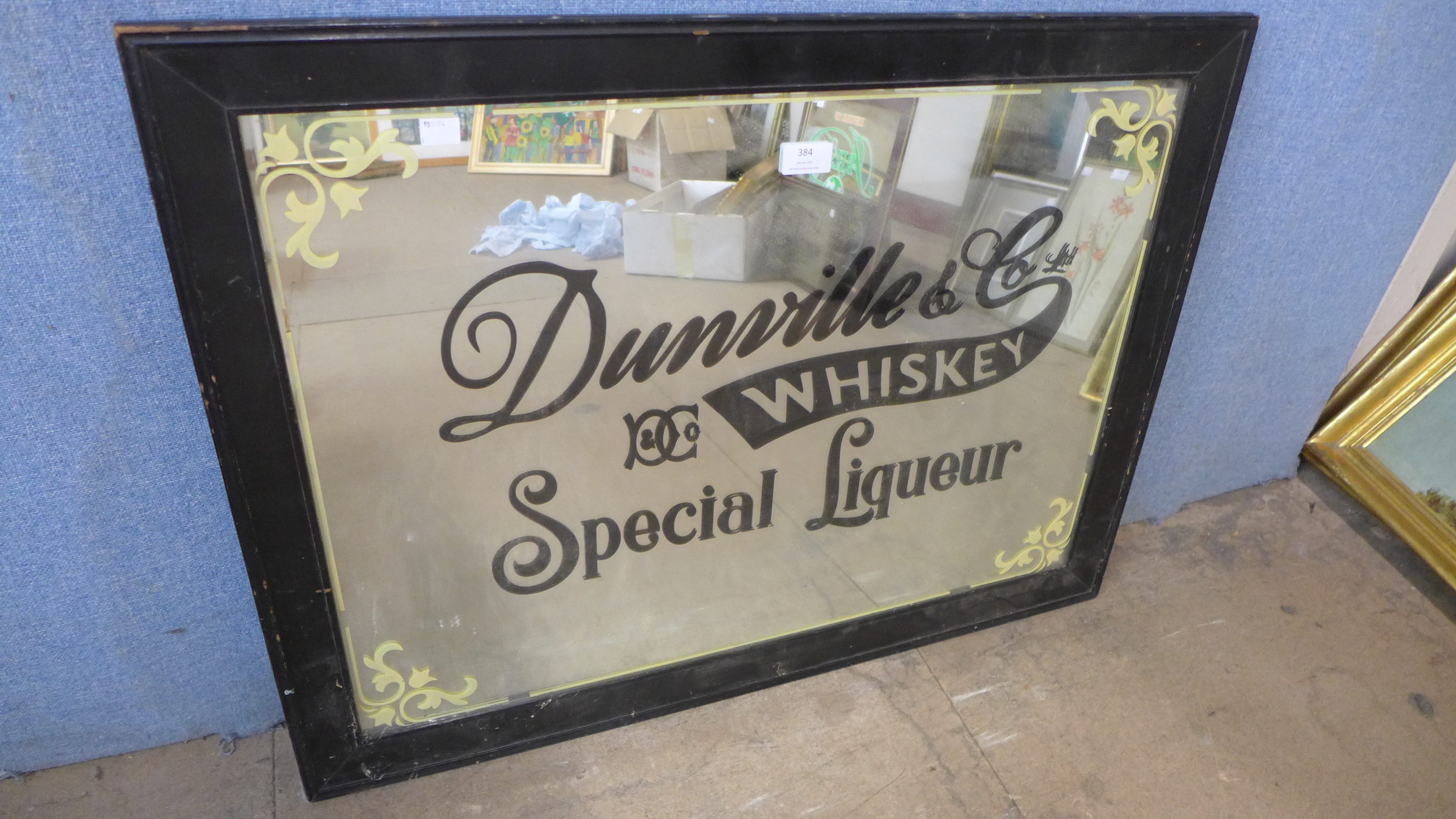 A Dunville & Co. Whiskey Special Liqueur advertising mirror