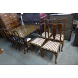 A Victorian mahogany dining table, 75 cms h, 126 cms l, 107 cms w and six mahogany dining chairs