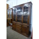 An 18th Century style oak library bookcase, 197cms h, 155cms w, 39cms d