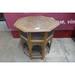 An Indian hardwood and brass inlaid folding octagonal occasional table, 51cms h