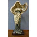 An Art Nouveau style painted terracotta figure of a semi nude female