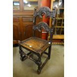 A Carolean style carved oak side chair