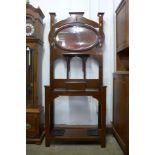 An Arts and Crafts walnut hallstand, 193cms h, 83cms w, 31cms d