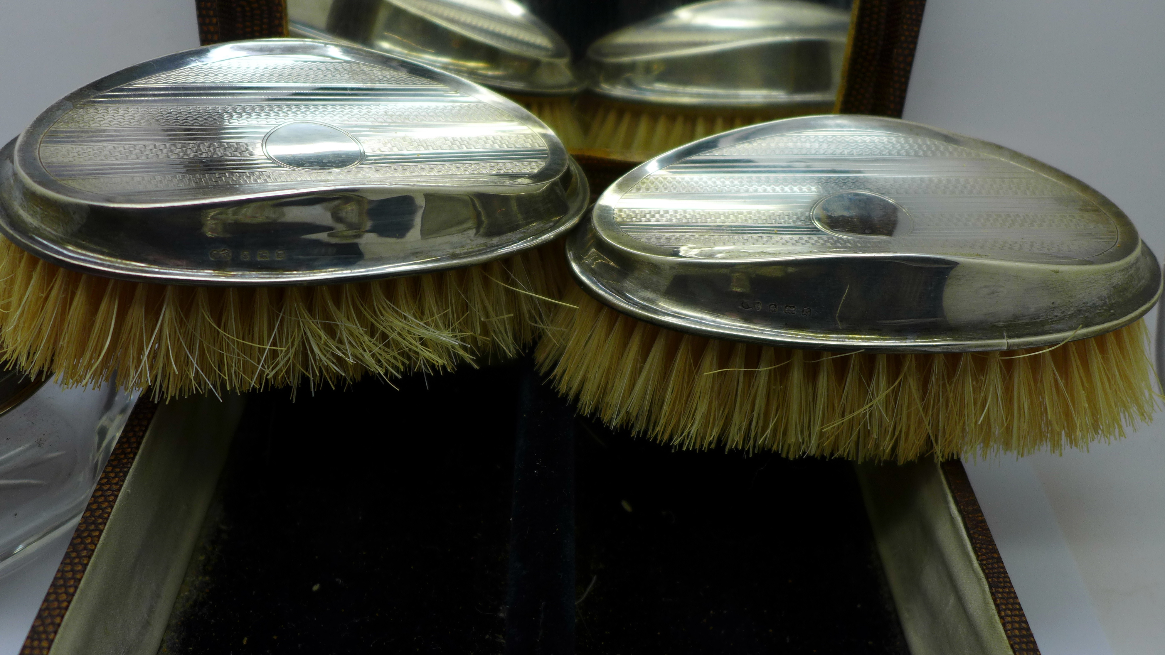 A pair of silver backed brushes, cased, a silver and enamel mirror, a/f, a silver topped glass - Image 4 of 5