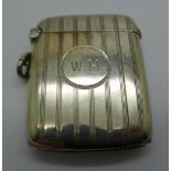 A silver vesta case