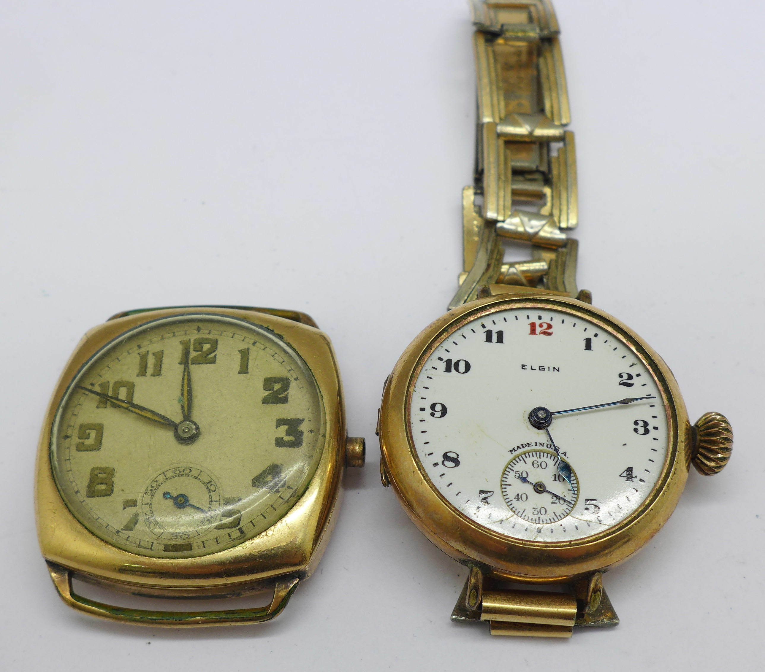 A cushion shaped wristwatch (lacking crown) and an Elgin gold plated trench watch (lacking glass)