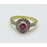 A silver gilt, ruby and white topaz ring, M