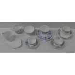 A Shelley Regency trio, a pair of Harebell cups and saucers, two cups and saucers and a sugar bowl
