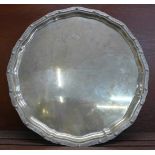 A large silver tray on three feet, with presentation inscription, by Adie Bros., Birmingham 1933,