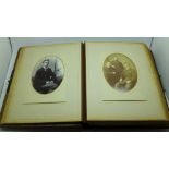 A Victorian album containing eighty cabinet cards and carte de visite