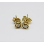 A pair of 9ct gold and diamond ear studs