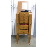 A large jewellery chest with costume jewellery, tie-pins and cufflinks