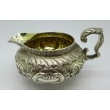A George IV silver embossed cream jug, London 1824, Michael Starkey, 304g
