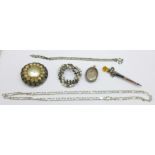 A silver locket, a sterling silver Scottish brooch, a silver necklace, a silver bracelet and two