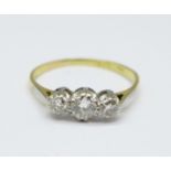 An 18ct gold, platinum set three stone diamond ring, 1.8g, O