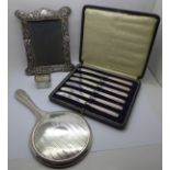 A silver backed hand mirror, a silver Art Nouveau photograph frame, some a/f and lacking back stand,
