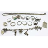 A silver charm bracelet, silver and other rings, etc.