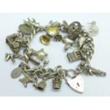 A silver charm bracelet, weight 88.5g