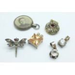 Four silver pendants, a silver brooch, a/f and a hallmarked silver photograph locket, Birmingham