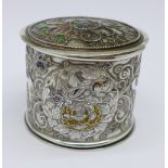 A white metal and enamel lidded pot with removeable base to make a napkin ring, enamel a/f